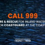 Call 999 fire & rescue for inland waters or coastguard at the coast